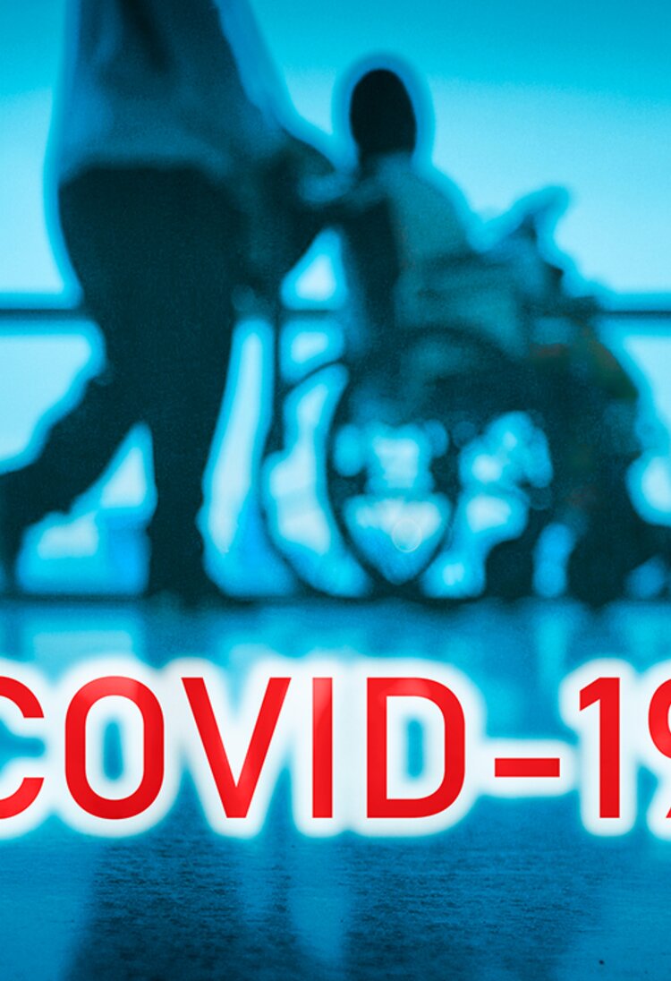 Covid 19 - person being wheeled on the wheel chair  | © University of Pretoria