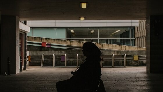 Woman on Wheelchair - dark space | © Nathan McDine on Unsplash